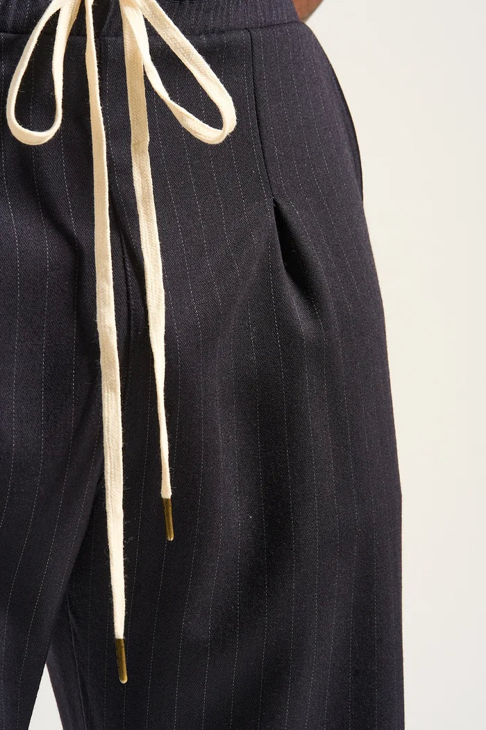 Close-up of the English-milled pinstripe wool and drawstring
